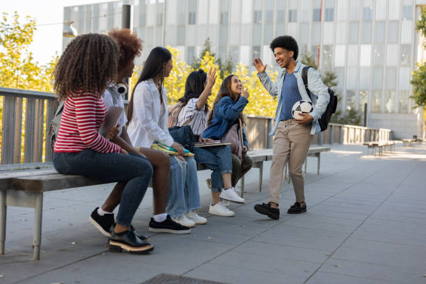 istock student friends sitting in the campus garden 1457174778