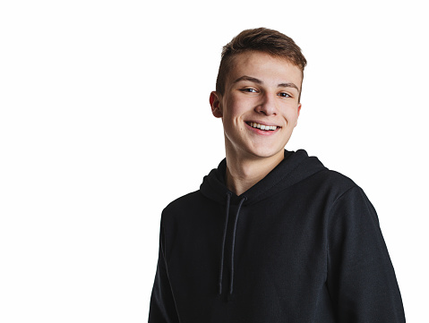Teenage boy in black hoodie  isolated on white background