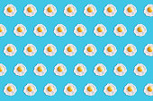 Fried egg pattern on blue background