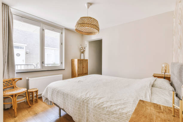 istock Light bedroom with wooden wardrobe 1457181089