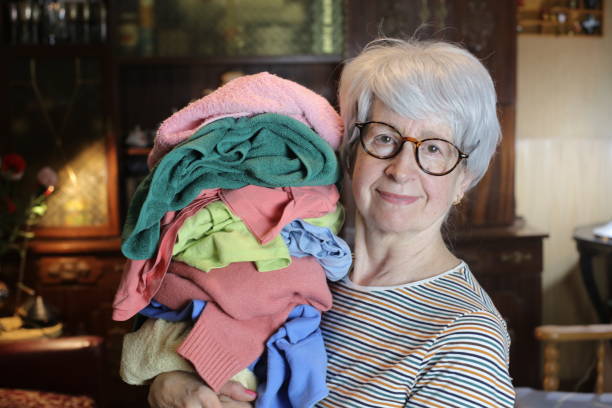 istock Senior woman about to do laundry 1457182376