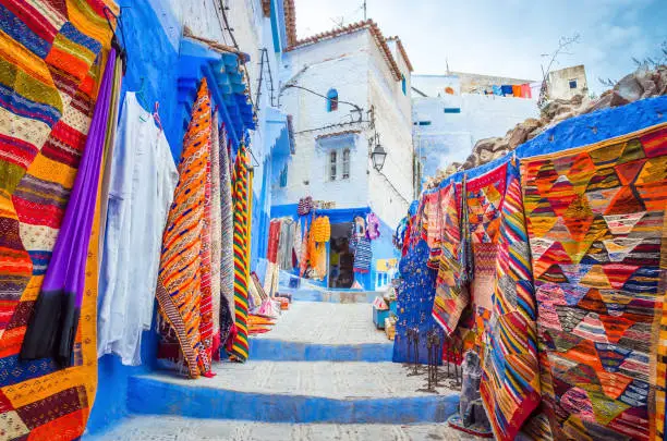 Photo of Street market in blue medina of city Chefchaouen,  Morocco, Africa.