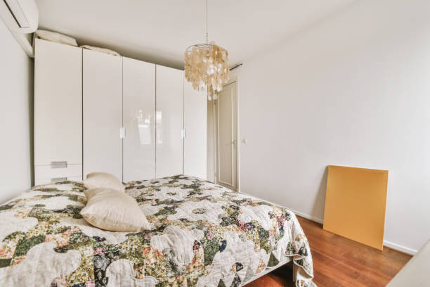 istock Light bedroom with wooden wardrobe 1457184086
