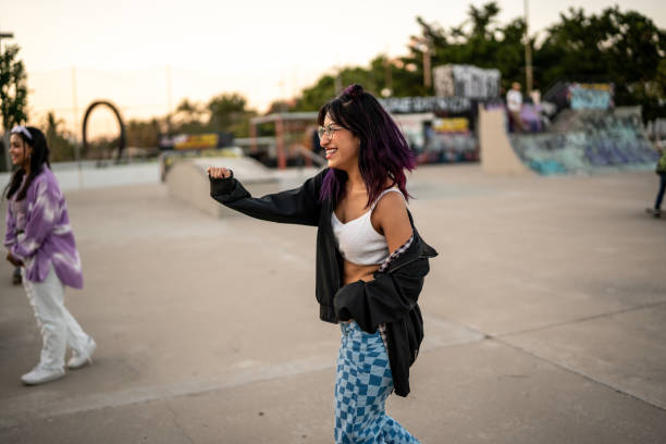 istock Young woman dancing at skateboard park 1457187136