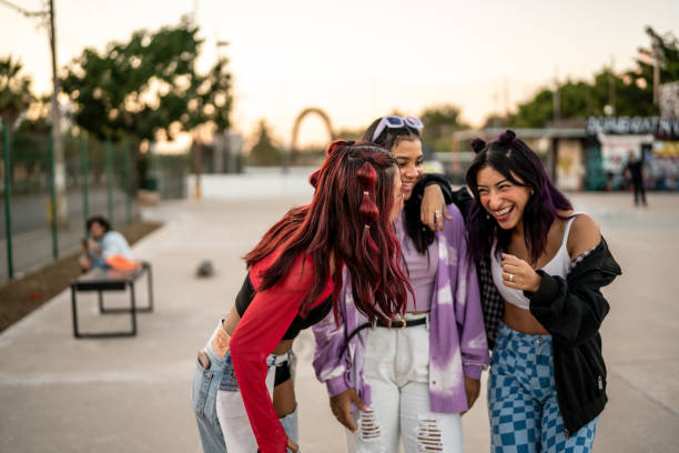istock Female friends having fun while walking at skateboard park 1457187175