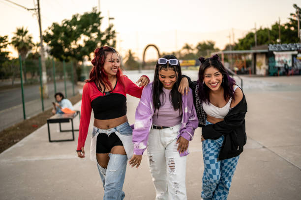 istock Female friends having fun while walking at skateboard park 1457187186
