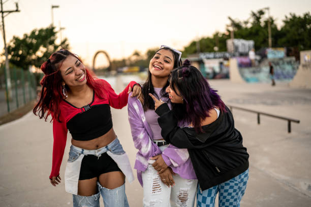 istock Female friends having fun while walking at skateboard park 1457187207