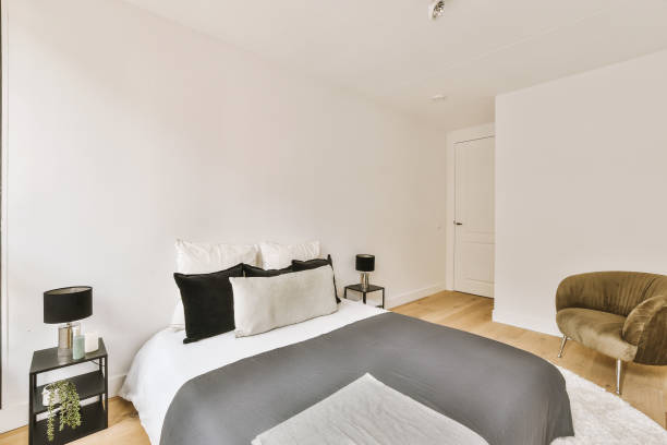 istock Light bedroom with wooden wardrobe 1457190401