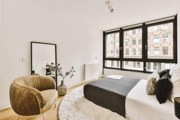 istock Light bedroom with wooden wardrobe 1457190458