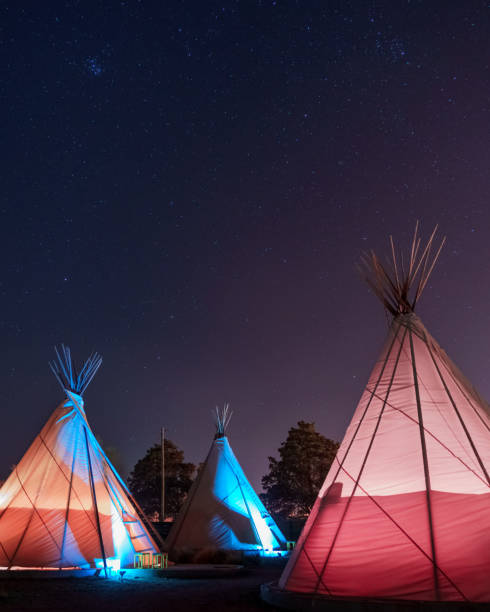istock Teepees glowing under a starry sky at night in Marfa, Texas 1457194342