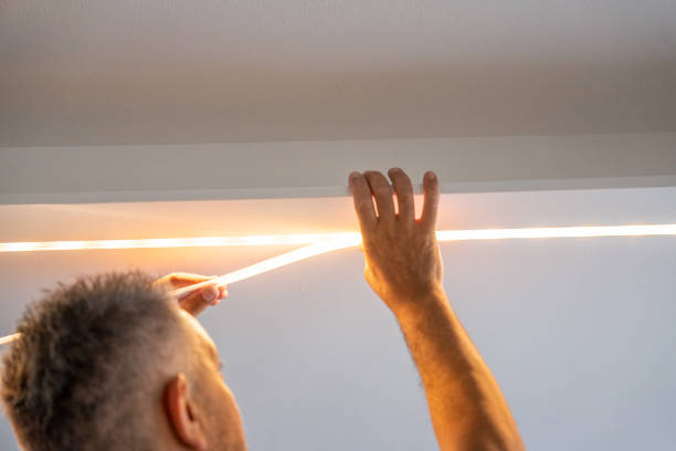 istock Installing led strip for lighting correctly on the surface of the Cabinet on the kitchen set 1457196802