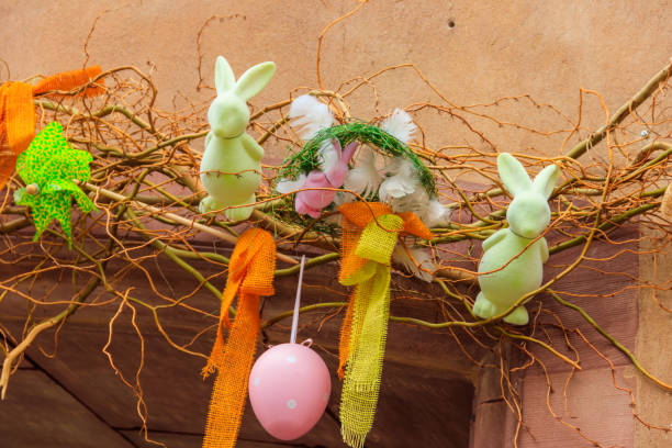 istock Easter decoration with Easter bunnies and Easter eggs on a house 1457197963