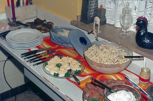 Berlin (West), Germany, 1978. House party buffet with the typical pasta salad in a large bowl.