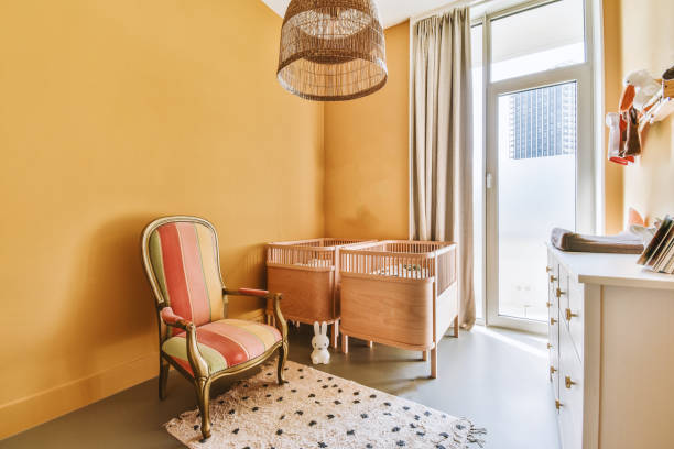 istock Light cozy baby room with cot 1457199219