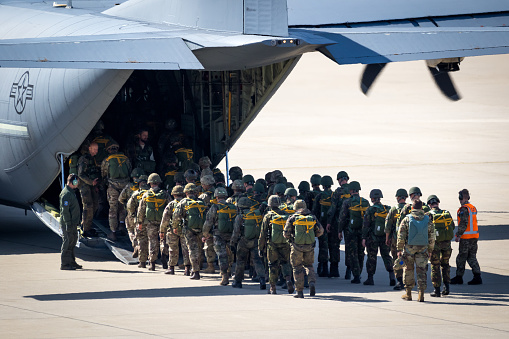 Paratroopers entering a US Air Force C-130 Hercules transport plane on Eindhoven airbase. Eindhoven, The Netherlands - September 20, 2019
