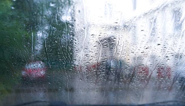 istock Wet glass from the rain. Drops on glass 1457199808