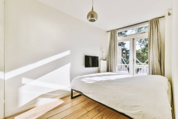 istock Light bedroom with wooden wardrobe 1457202500