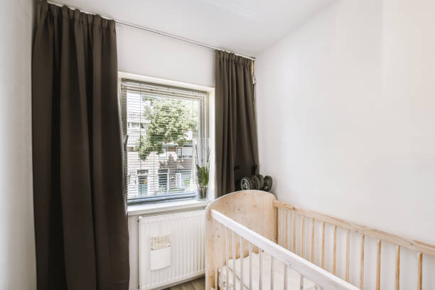 istock Light cozy baby room with cot 1457204181