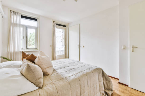 istock Light bedroom with wooden wardrobe 1457204228