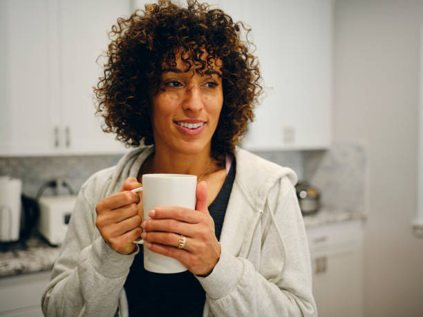 istock Woman Making Coffee in a Home Kitchen 1457204749