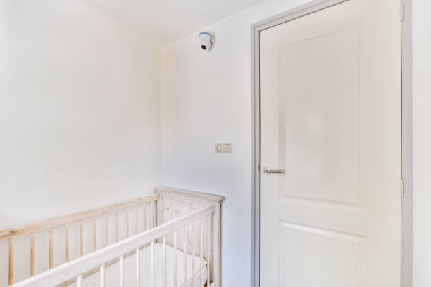 istock Light cozy baby room with cot 1457205087