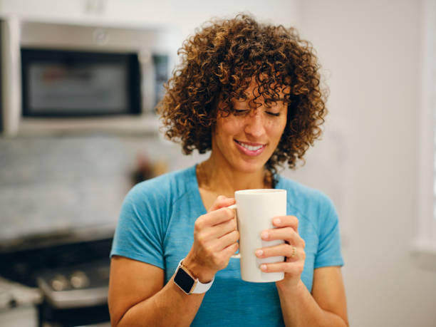 istock Woman Making Coffee in a Home Kitchen 1457206034