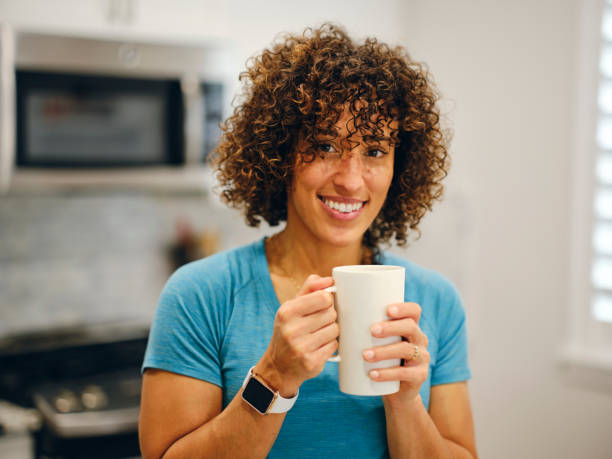 istock Woman Making Coffee in a Home Kitchen 1457206041