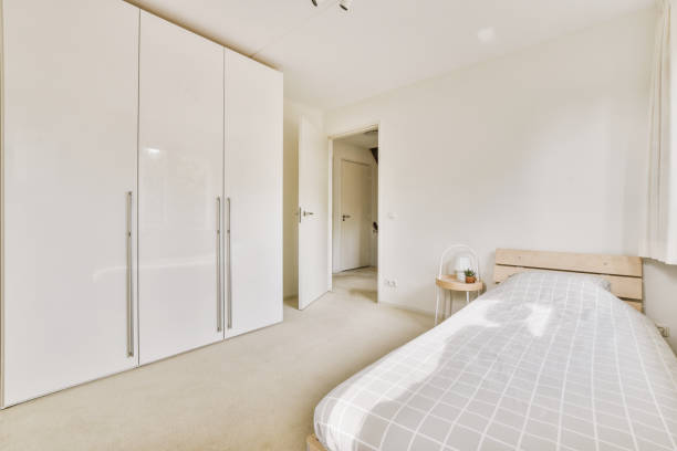 istock Light bedroom with wooden wardrobe 1457206898