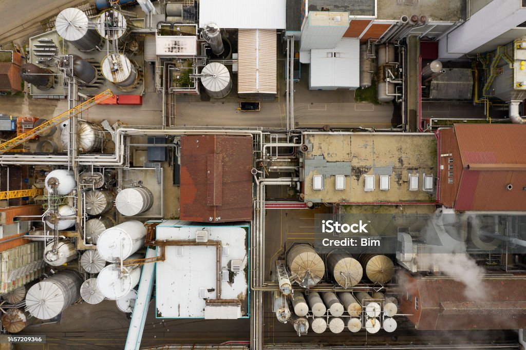 Aerial View of Industrial Factory, Paper Mill Industrial plant, paper mill, with smoking chimneys viewed directly from above. Paper Mill Stock Photo