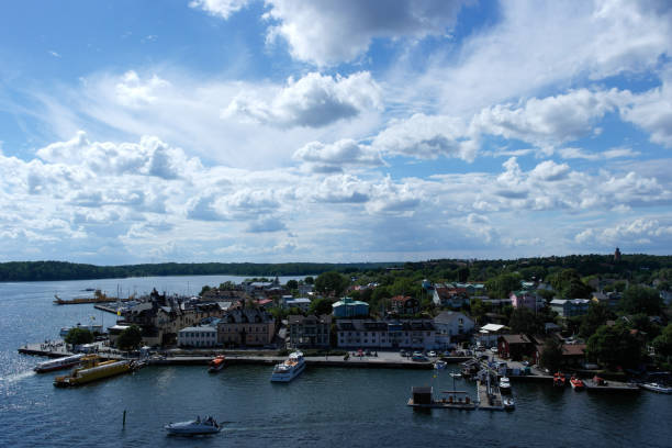 istock High angle view of boats moored at harbor against sky 1457211897