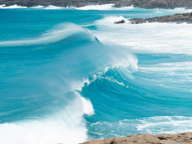 Rolling breaking waves stock photo