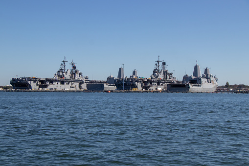 Naval Station Norfolk, VA, United States - October 14, 2022: Naval Station Norfolk is the world's largest naval station. The installation occupies about 4 miles of waterfront space and 11 miles of pier and wharf space of the Hampton Roads peninsula known as Sewell's Point.