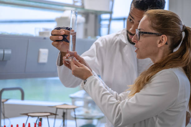istock Chemistry professor and students in the laboratory 1457228157