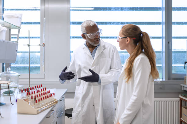 istock Chemistry professor and students in the laboratory 1457228200