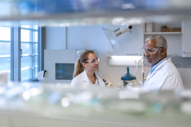 istock Chemistry professor and students in the laboratory 1457228217