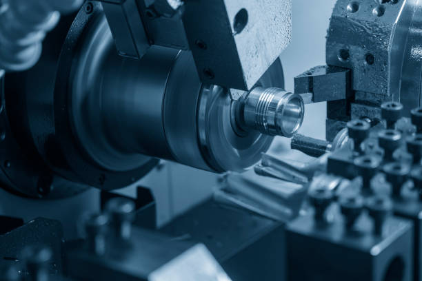 istock The multi-tasking CNC lathe machine swiss type thread cutting the metal pipe parts. 1457239471