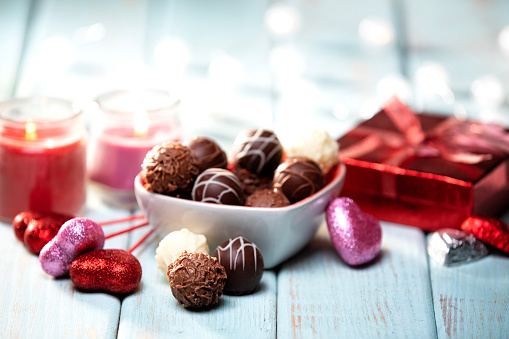 Macro close-up of a gift box of gourmet chocolates.