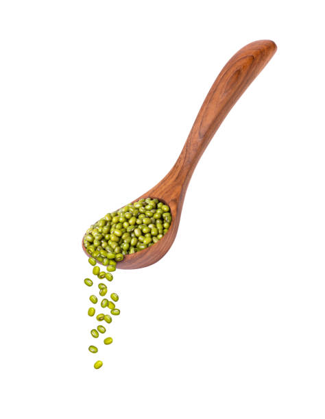 green mung beans isolated on white - falling beans imagens e fotografias de stock