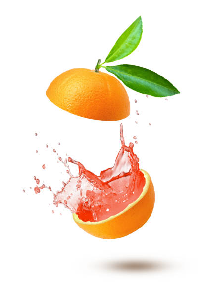 suco de toranja splash - isolated on white orange juice ripe leaf - fotografias e filmes do acervo