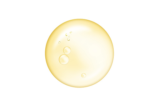 Yellow bubble oil drop or serum collagen drops isolated on white background. Beauty and spa, medical healthcare concept.