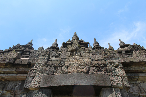Intrigue carvings of Plaosan temple wall in Java, Indonesia. Taken in July 2022.