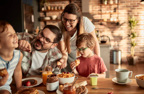 istock Young family having breakfast at home 1457249880