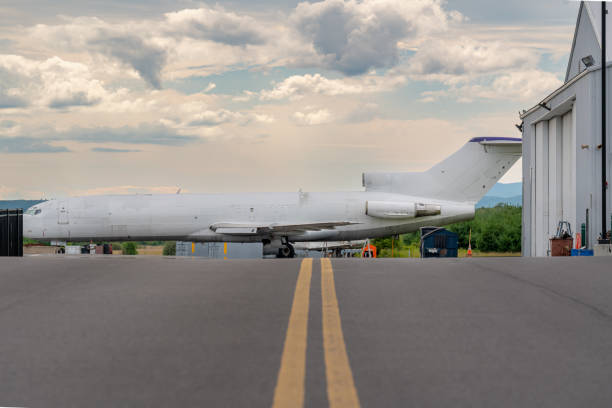 istock Side view of a parked older passenger jet that was converted into a cargo transport. 1457251293