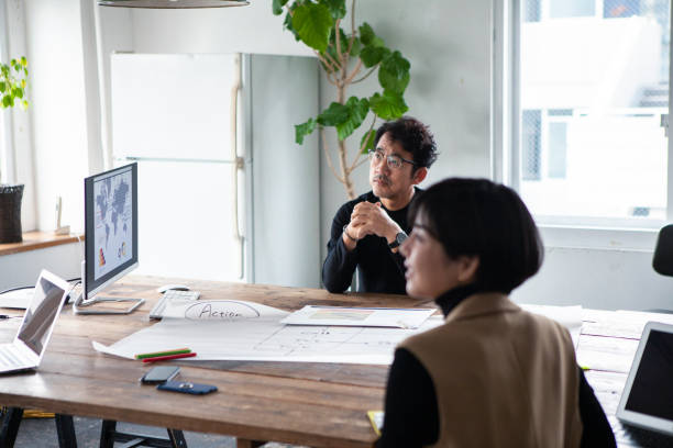 istock One Asian man presenting his ideas at a conference 1457254086