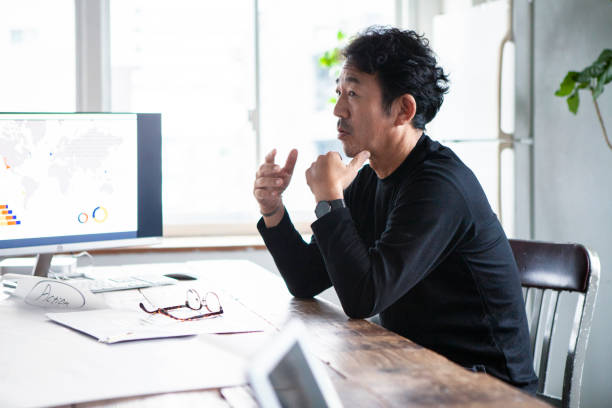 One Asian man presenting his ideas at a conference