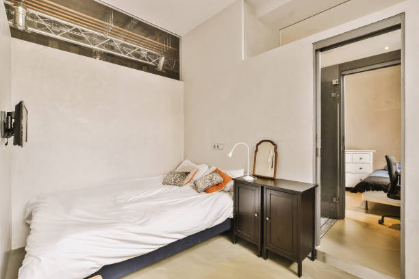 istock Light bedroom with wooden wardrobe 1457257623