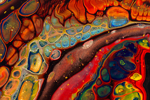Colorful fluid art painting. This abstract painting technique gives a marbled textured effect.