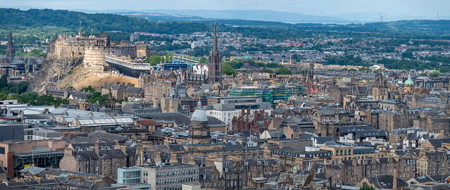 Cityscape of the Capital city of Scotland,with famous landmarks such as Edinburgh Castle set for the Royal MilitaryTattoo,during Fringe Festival,the Hub and St. Mary's Cathedral.