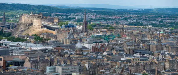 Cityscape of the Capital city of Scotland,with famous landmarks such as Edinburgh Castle set for the Royal MilitaryTattoo,during Fringe Festival,the Hub and St. Mary's Cathedral.