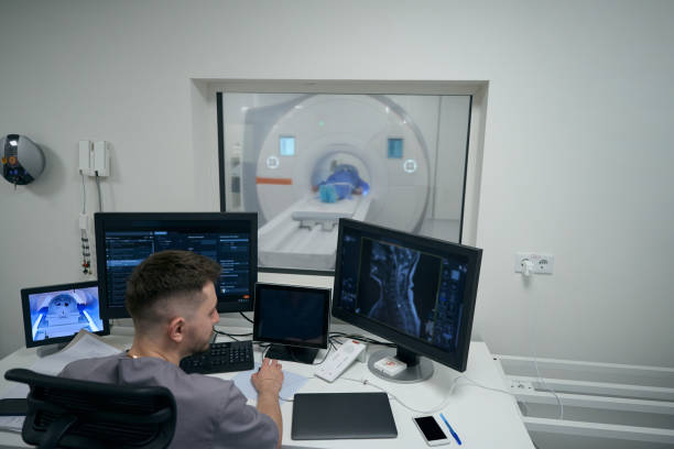 istock Young doctor conducts MRI diagnostics in a modern clinic 1457266948